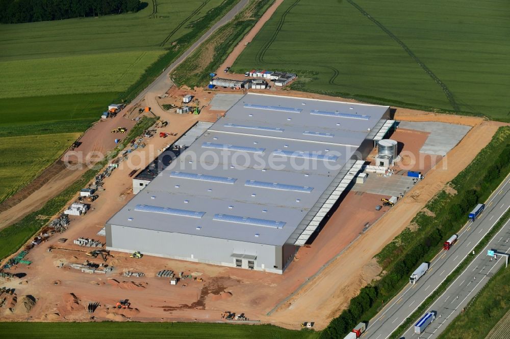 Aerial photograph Meerane - Construction site for the construction of a new logistics center for SAS Autosystemtechnik GmbH & Co. KG in the Meerane-Crimmitschau business park in Meerane, Saxony, Germany