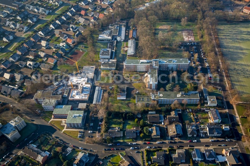 Hamm from the bird's eye view: Construction site for the new building of the LWL-Schule for patients of LWL university hospital at Heithofer Allee midst a residential area in Hamm in the state North Rhine-Westphalia