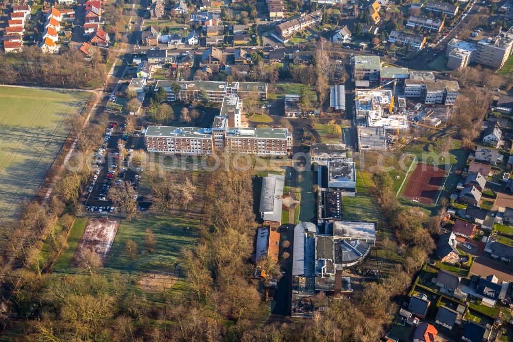 Aerial photograph Hamm - Construction site for the new building of the LWL-Schule for patients of LWL university hospital at Heithofer Allee midst a residential area in Hamm in the state North Rhine-Westphalia