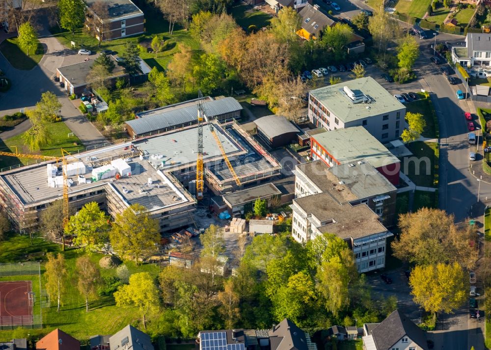 Aerial photograph Hamm - Construction site for the new building of the LWL-Schule for patients of LWL university hospital at Heithofer Allee midst a residential area in Hamm in the state North Rhine-Westphalia