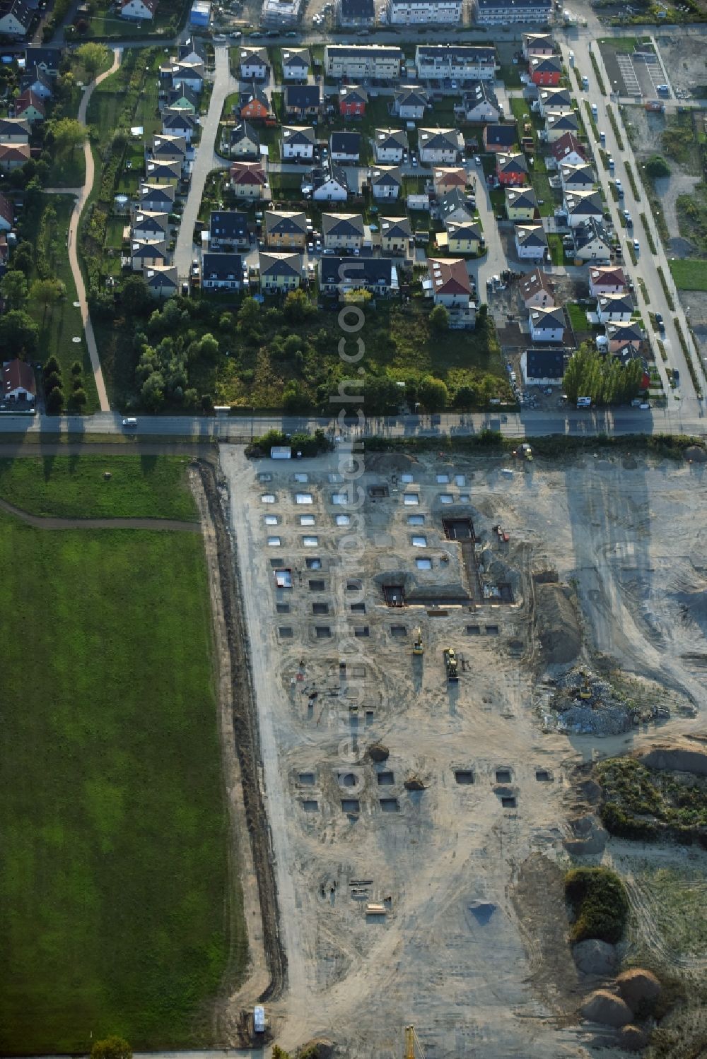 Berlin from the bird's eye view: Construction site for the new building home-center of the Porta-Group at Pilgramer street in the district Mahlsdorf in Berlin