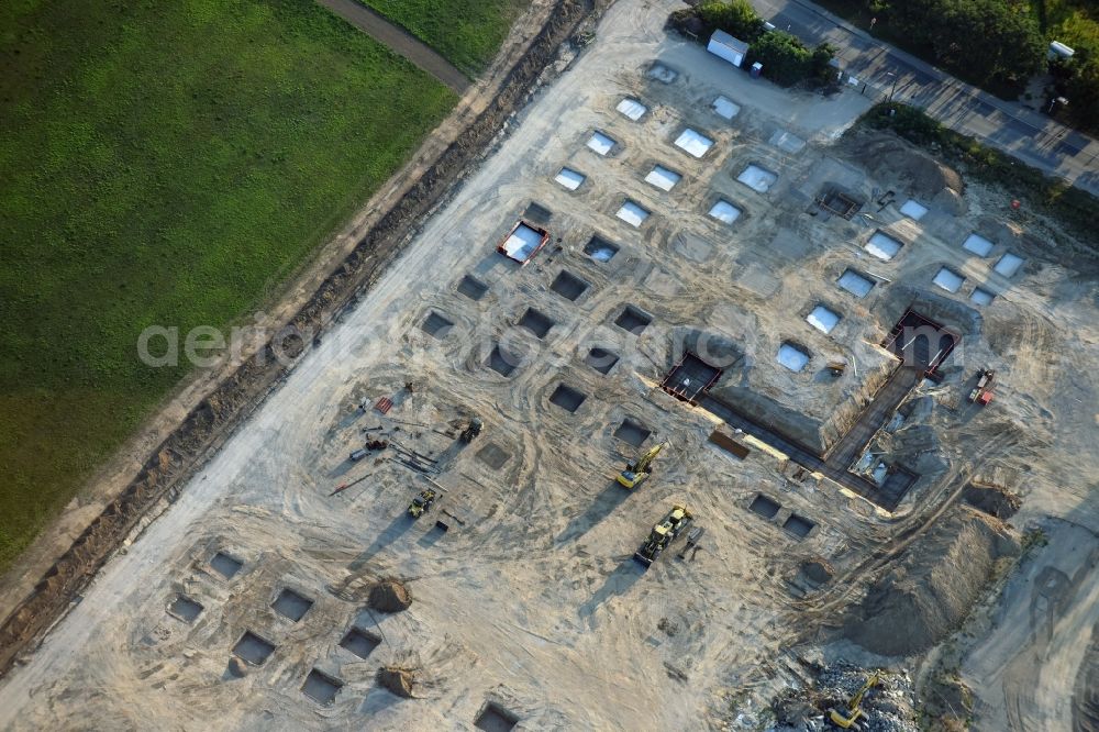 Berlin from the bird's eye view: Construction site for the new building home-center of the Porta-Group at Pilgramer street in the district Mahlsdorf in Berlin