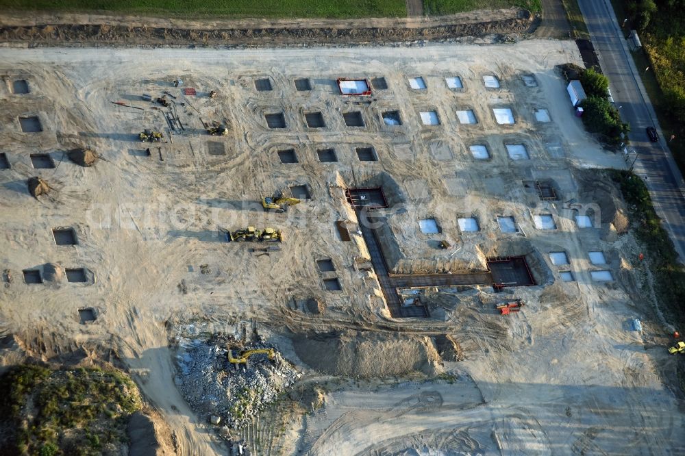 Berlin from the bird's eye view: Construction site for the new building home-center of the Porta-Group at Pilgramer street in the district Mahlsdorf in Berlin