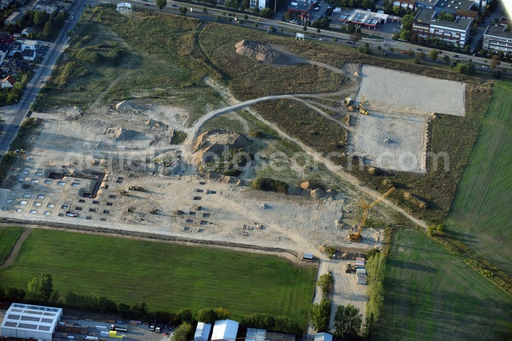 Berlin from the bird's eye view: Construction site for the new building home-center of the Porta-Group at Pilgramer street in the district Mahlsdorf in Berlin