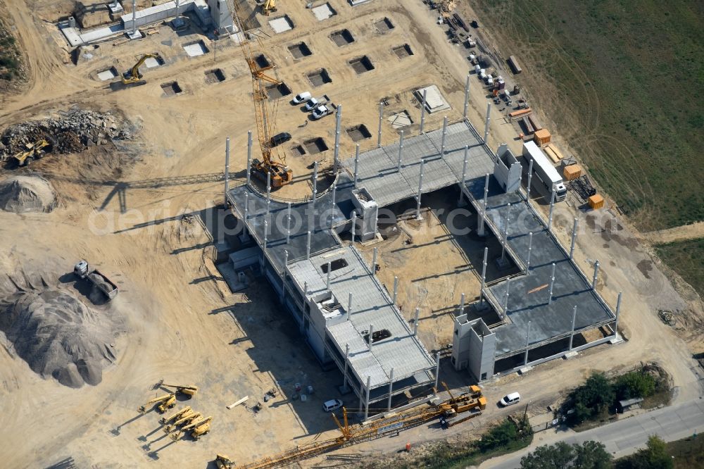 Aerial photograph Berlin - Construction site for the new building home-center of the Porta-Group at Pilgramer street in the district Mahlsdorf in Berlin