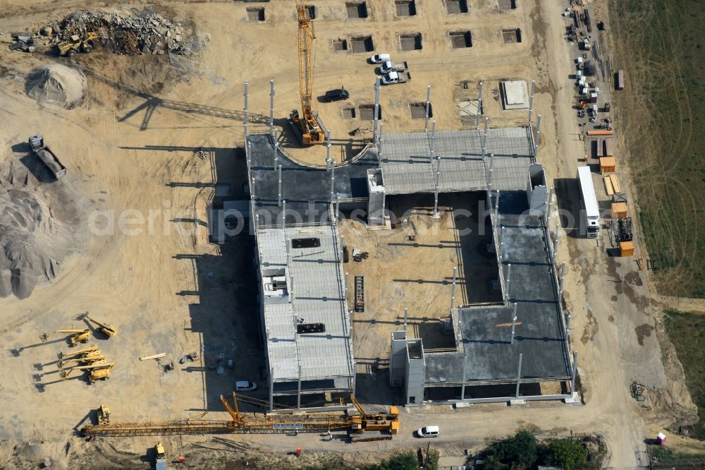 Berlin from above - Construction site for the new building home-center of the Porta-Group at Pilgramer street in the district Mahlsdorf in Berlin