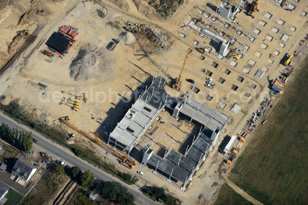 Berlin from above - Construction site for the new building home-center of the Porta-Group at Pilgramer street in the district Mahlsdorf in Berlin