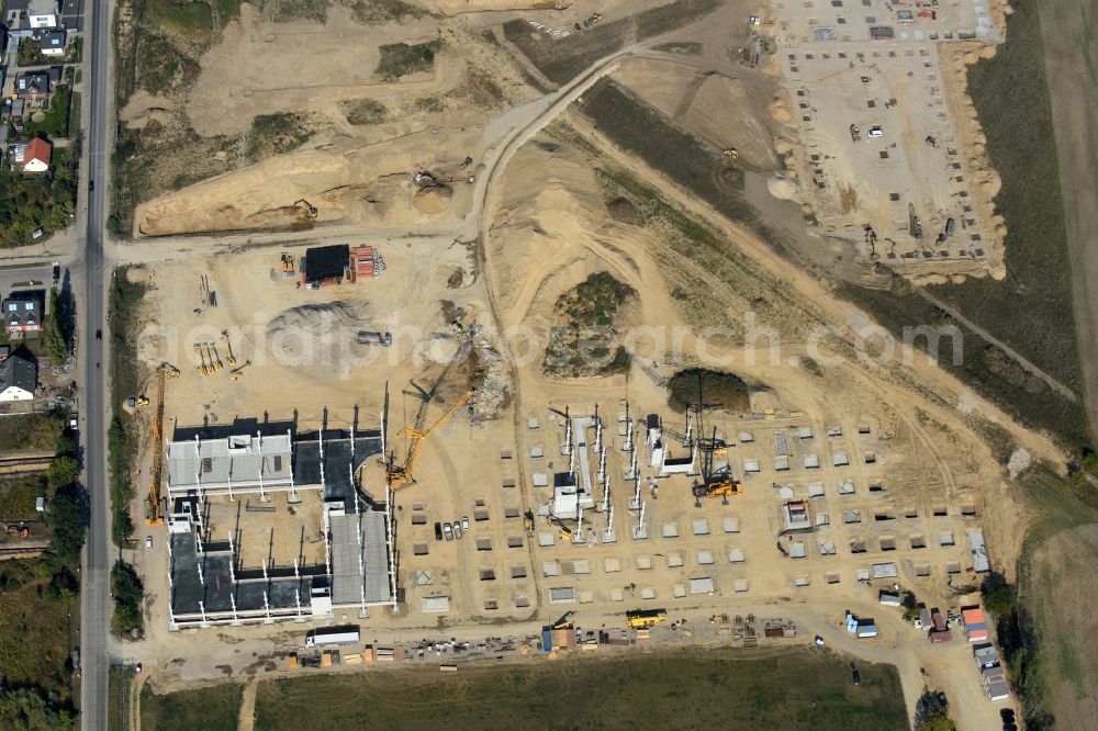 Aerial image Berlin - Construction site for the new building home-center of the Porta-Group at Pilgramer street in the district Mahlsdorf in Berlin