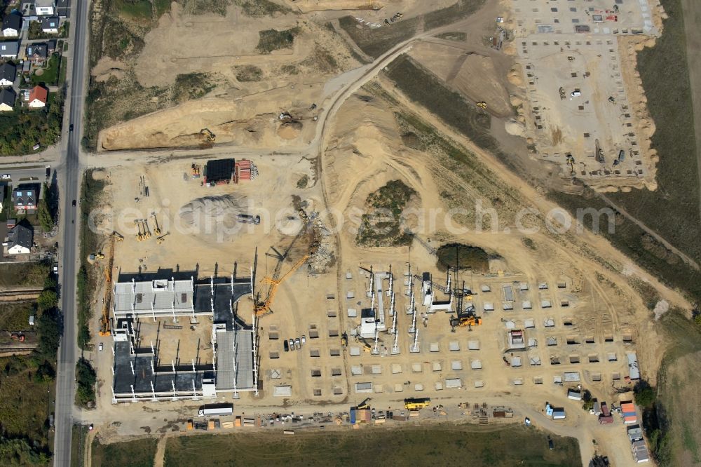 Aerial photograph Berlin - Construction site for the new building home-center of the Porta-Group at Pilgramer street in the district Mahlsdorf in Berlin