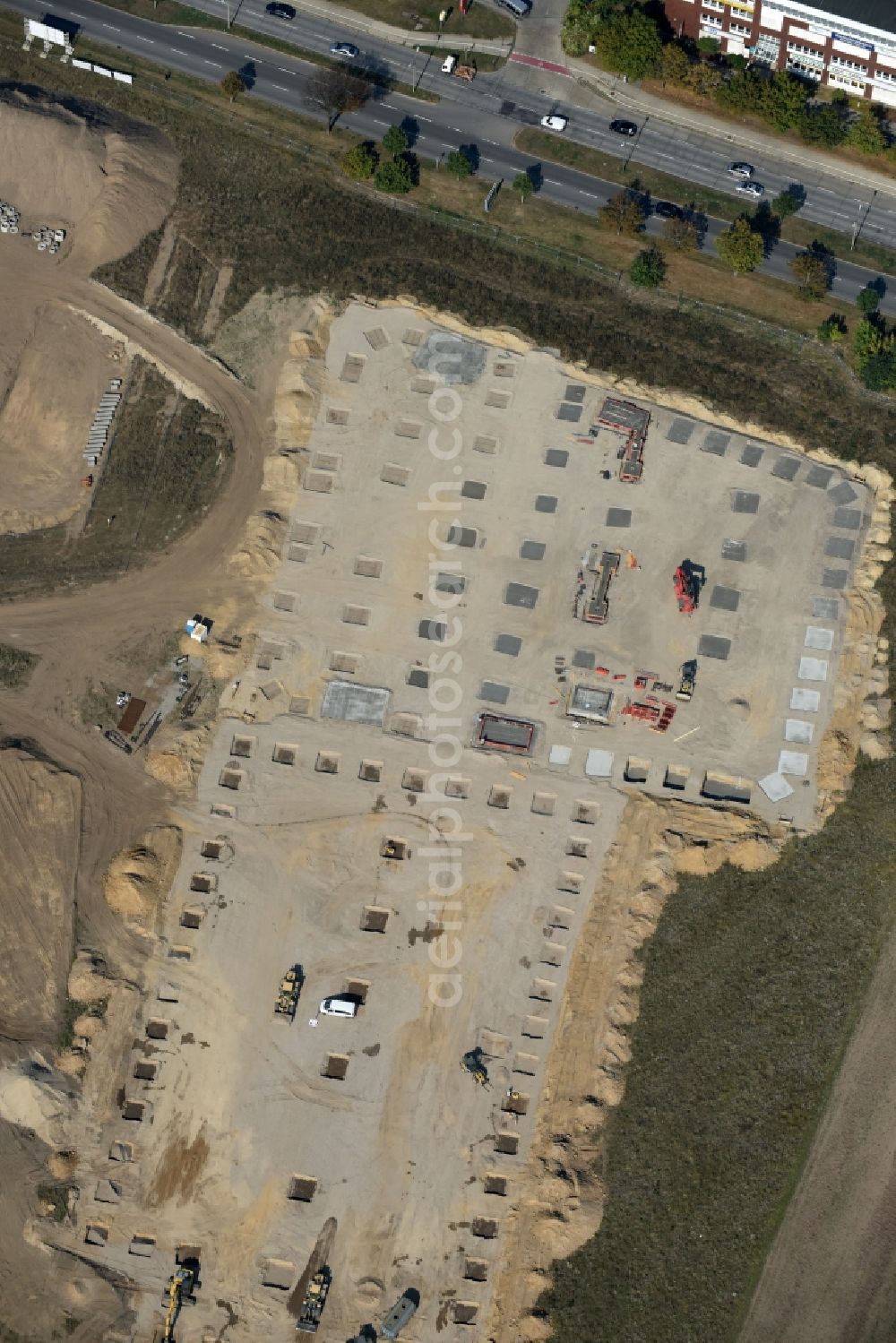 Berlin from the bird's eye view: Construction site for the new building home-center of the Porta-Group at Pilgramer street in the district Mahlsdorf in Berlin