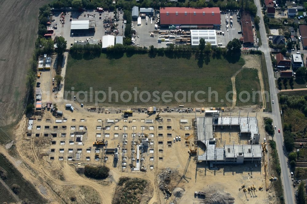 Berlin from above - Construction site for the new building home-center of the Porta-Group at Pilgramer street in the district Mahlsdorf in Berlin