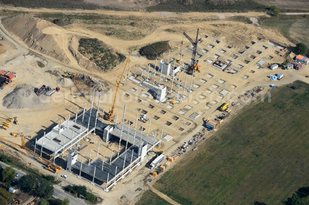 Aerial photograph Berlin - Construction site for the new building home-center of the Porta-Group at Pilgramer street in the district Mahlsdorf in Berlin