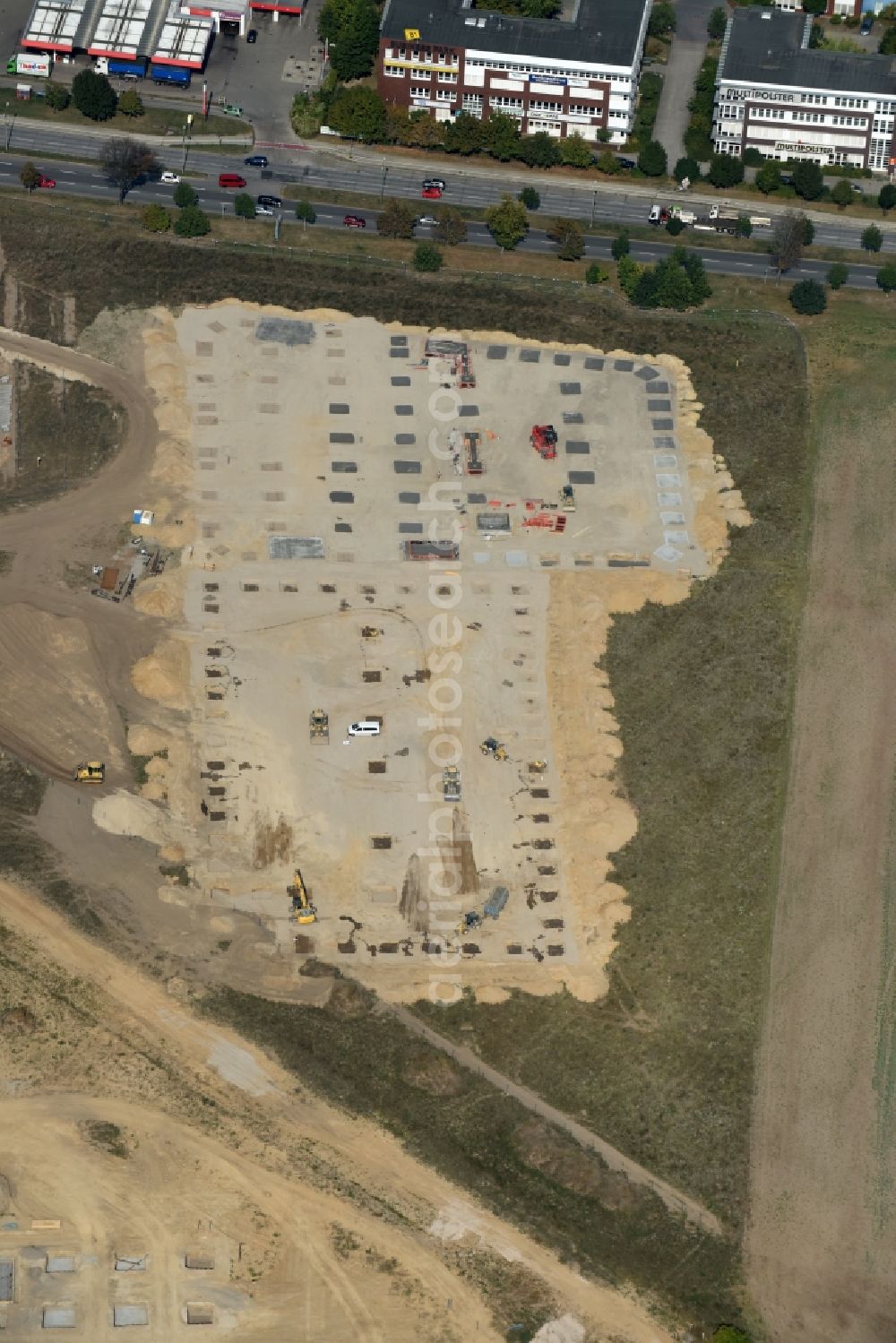 Berlin from the bird's eye view: Construction site for the new building home-center of the Porta-Group at Pilgramer street in the district Mahlsdorf in Berlin