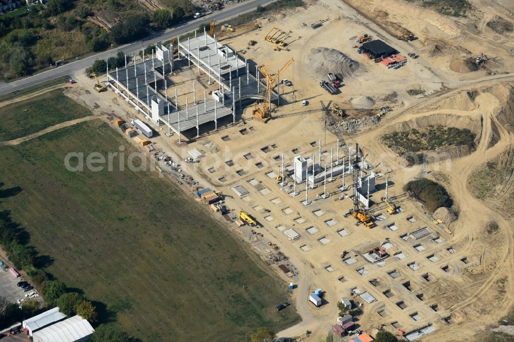 Aerial photograph Berlin - Construction site for the new building home-center of the Porta-Group at Pilgramer street in the district Mahlsdorf in Berlin