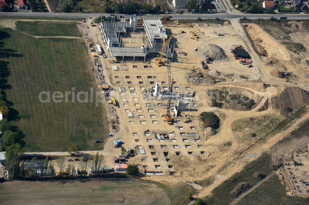 Berlin from above - Construction site for the new building home-center of the Porta-Group at Pilgramer street in the district Mahlsdorf in Berlin