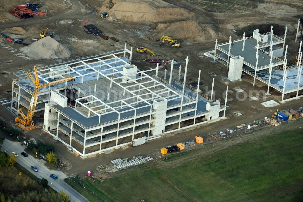 Berlin from the bird's eye view: Construction site for the new building home-center of the Porta-Group at Pilgramer street in the district Mahlsdorf in Berlin