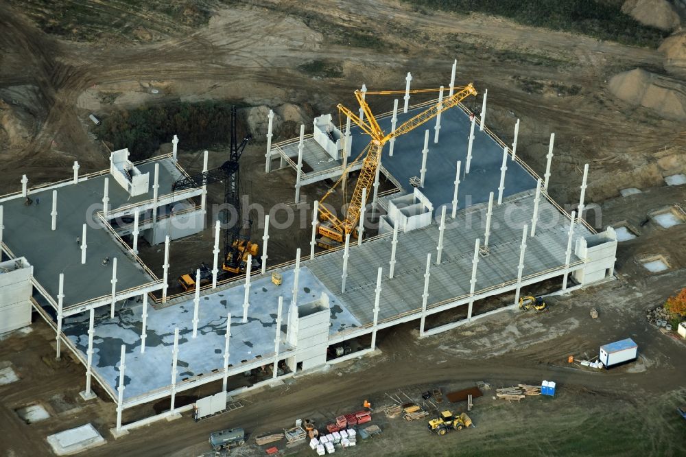 Berlin from the bird's eye view: Construction site for the new building home-center of the Porta-Group at Pilgramer street in the district Mahlsdorf in Berlin