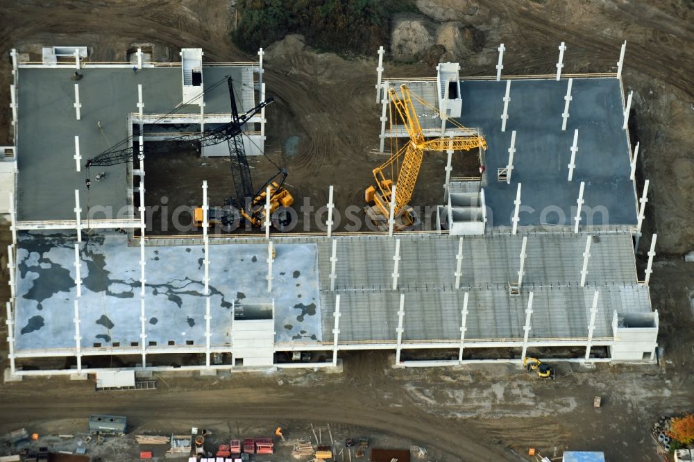 Berlin from above - Construction site for the new building home-center of the Porta-Group at Pilgramer street in the district Mahlsdorf in Berlin