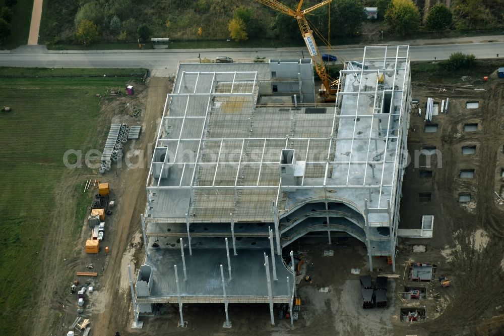 Berlin from the bird's eye view: Construction site for the new building home-center of the Porta-Group at Pilgramer street in the district Mahlsdorf in Berlin