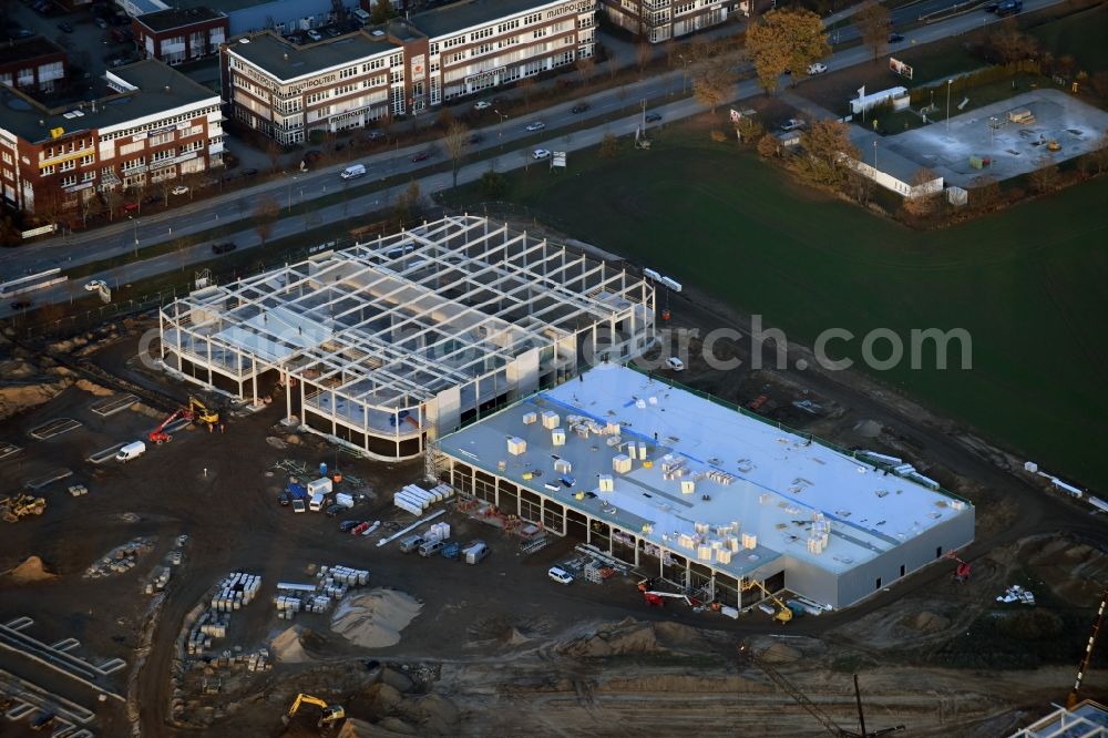 Berlin from the bird's eye view: Construction site for the new building home-center of the Porta-Group at Pilgramer street in the district Mahlsdorf in Berlin