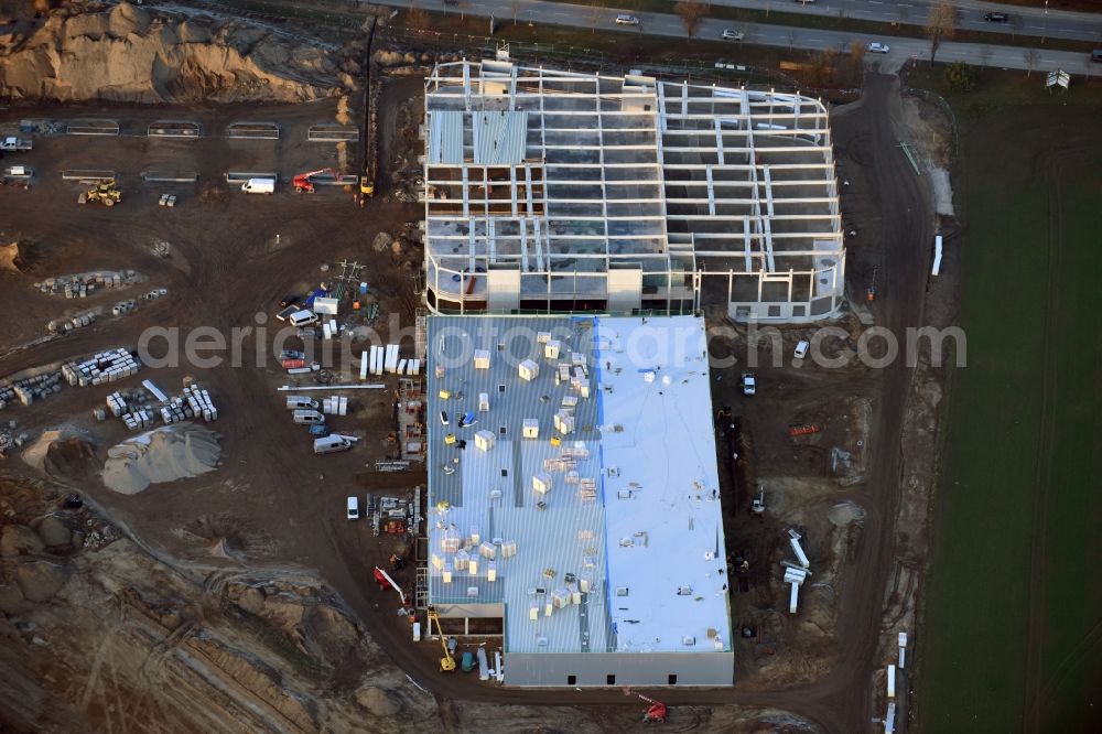 Berlin from the bird's eye view: Construction site for the new building home-center of the Porta-Group at Pilgramer street in the district Mahlsdorf in Berlin