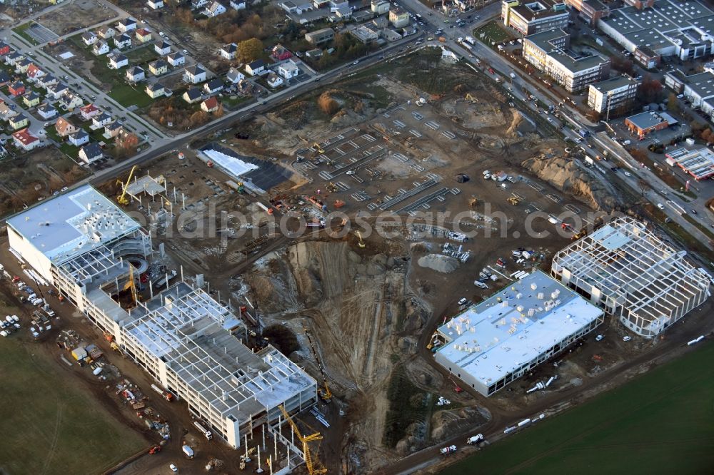 Berlin from the bird's eye view: Construction site for the new building home-center of the Porta-Group at Pilgramer street in the district Mahlsdorf in Berlin