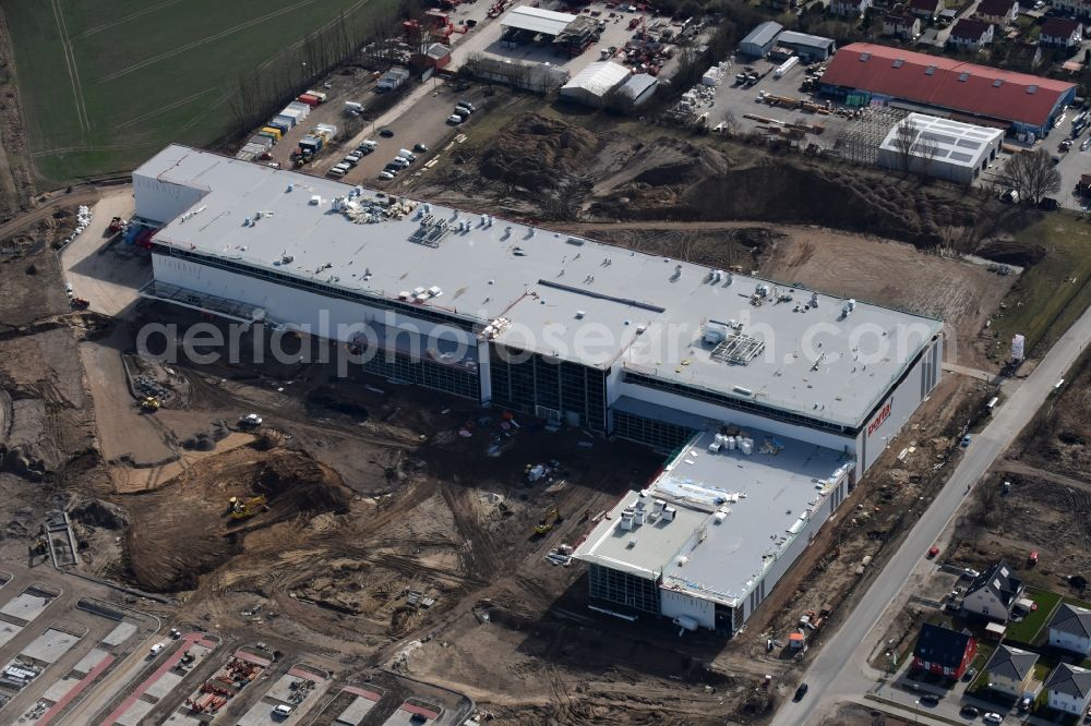 Berlin from above - Construction site for the new building home-center of the Porta-Group at Pilgramer street in the district Mahlsdorf in Berlin