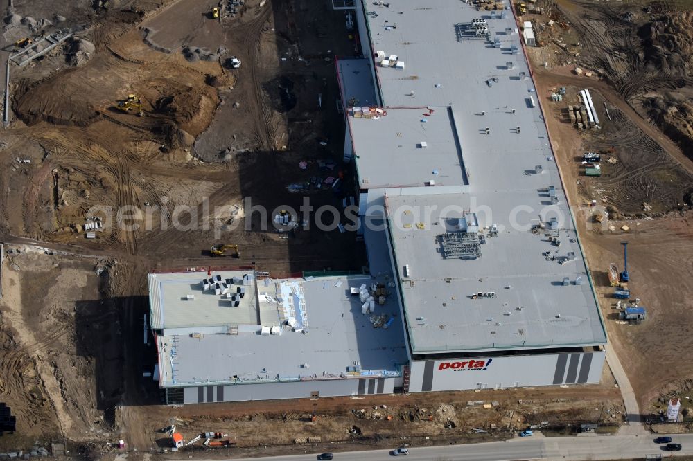 Aerial photograph Berlin - Construction site for the new building home-center of the Porta-Group at Pilgramer street in the district Mahlsdorf in Berlin