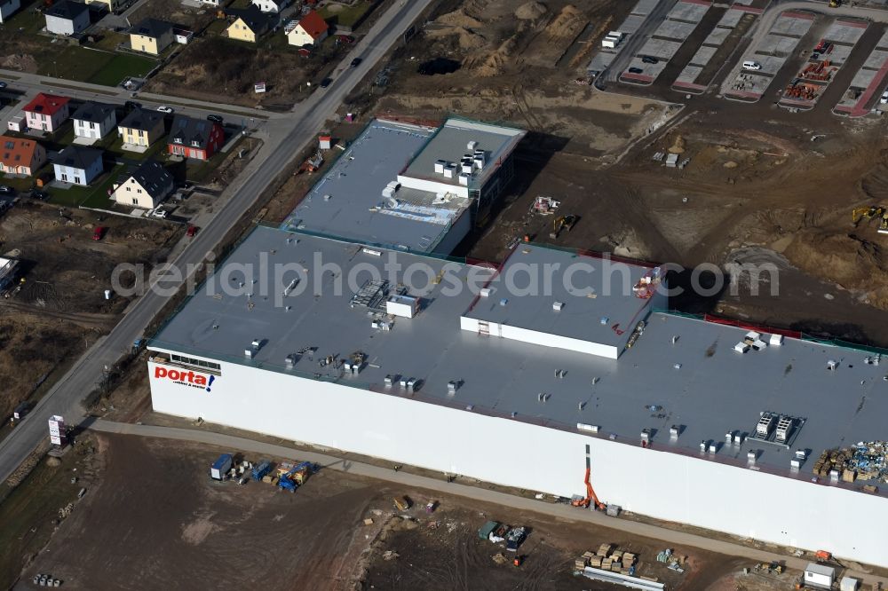 Berlin from above - Construction site for the new building home-center of the Porta-Group at Pilgramer street in the district Mahlsdorf in Berlin