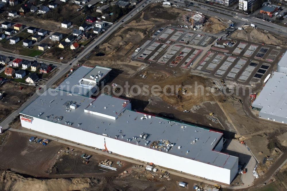 Berlin from the bird's eye view: Construction site for the new building home-center of the Porta-Group at Pilgramer street in the district Mahlsdorf in Berlin