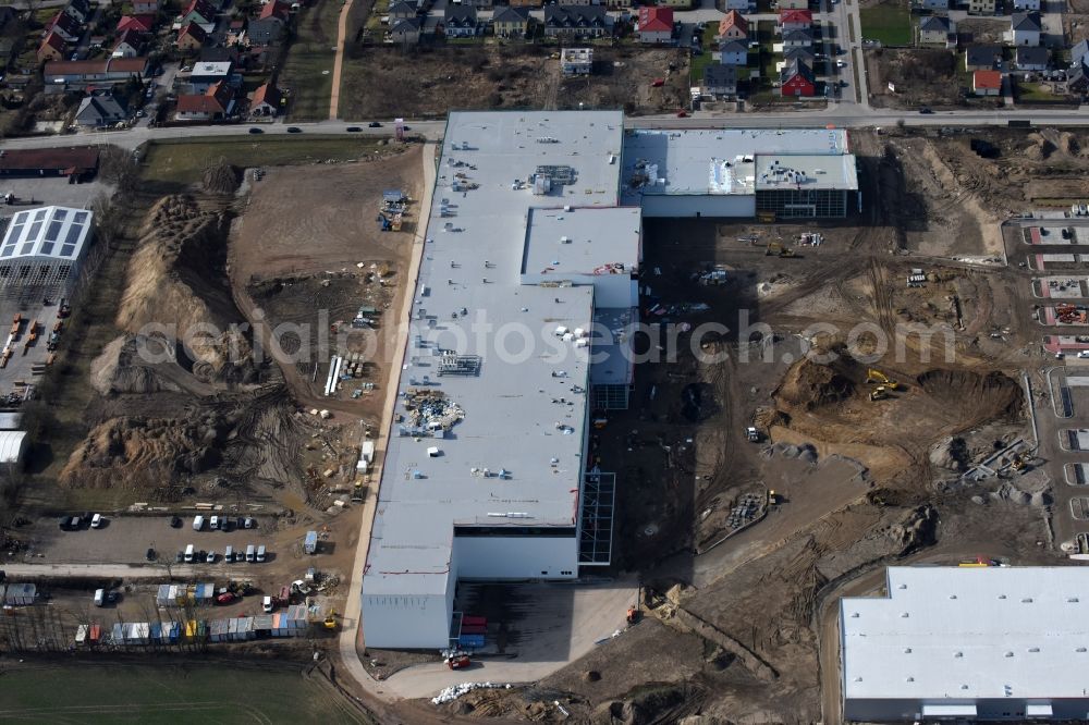 Aerial photograph Berlin - Construction site for the new building home-center of the Porta-Group at Pilgramer street in the district Mahlsdorf in Berlin