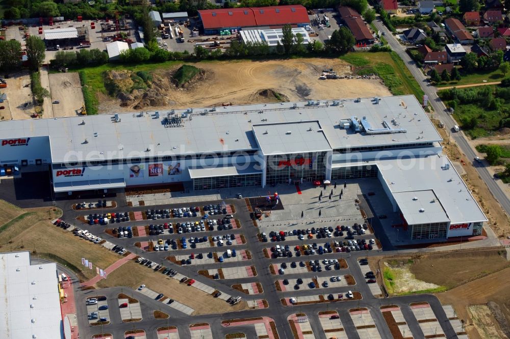 Aerial image Berlin - Construction site for the new building home-center of the Porta-Group at Pilgramer street in the district Mahlsdorf in Berlin