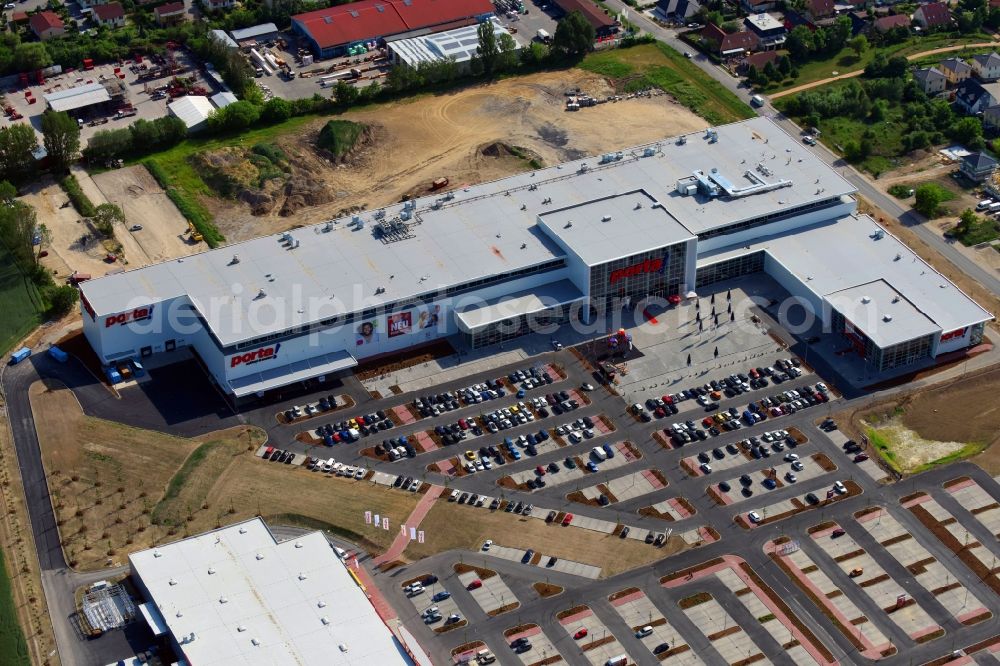 Aerial photograph Berlin - Construction site for the new building home-center of the Porta-Group at Pilgramer street in the district Mahlsdorf in Berlin