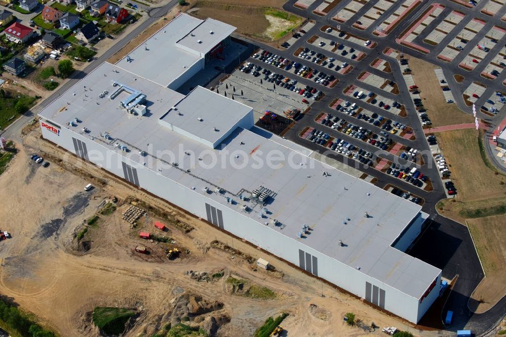 Aerial image Berlin - Construction site for the new building home-center of the Porta-Group at Pilgramer street in the district Mahlsdorf in Berlin