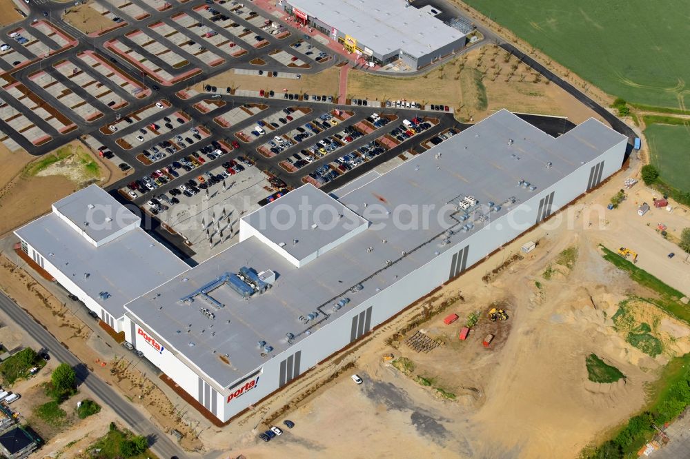 Berlin from above - Construction site for the new building home-center of the Porta-Group at Pilgramer street in the district Mahlsdorf in Berlin