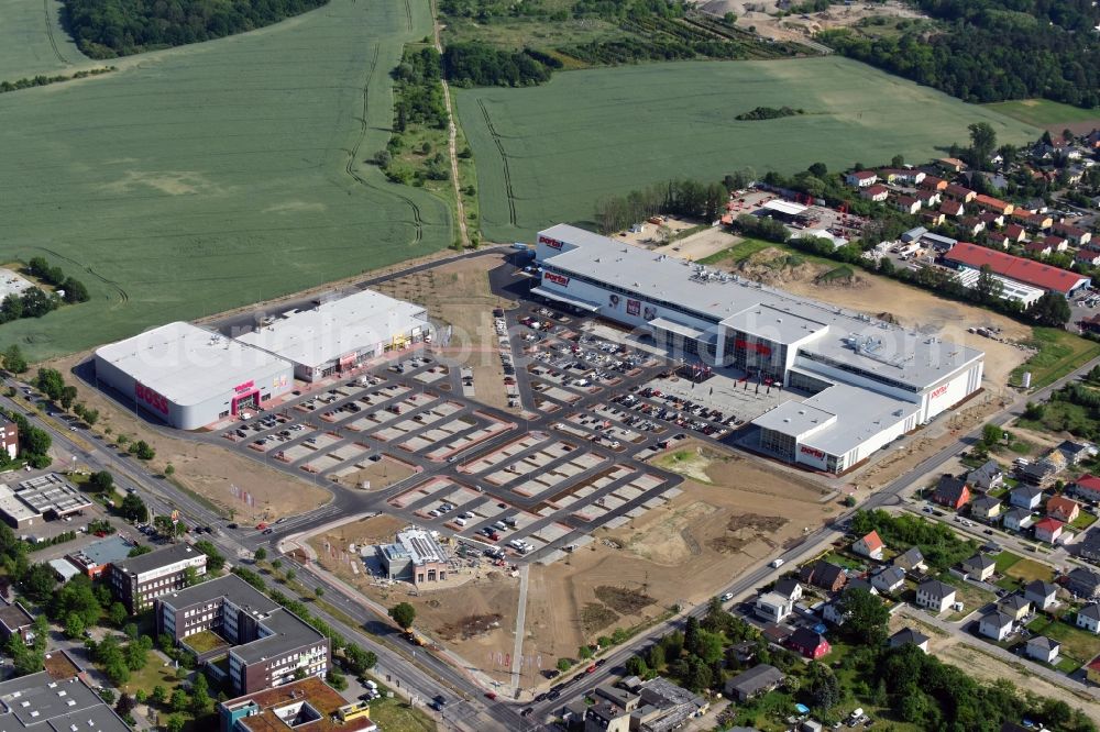 Berlin from the bird's eye view: Construction site for the new building home-center of the Porta-Group at Pilgramer street in the district Mahlsdorf in Berlin