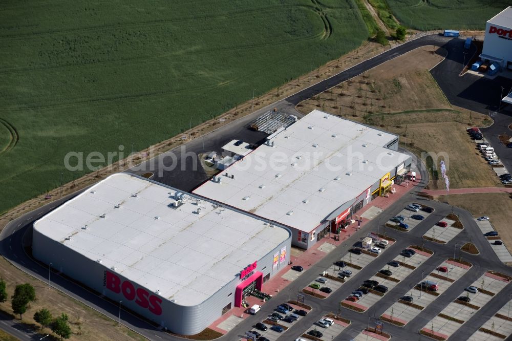 Aerial photograph Berlin - Construction site for the new building home-center of the Porta-Group at Pilgramer street in the district Mahlsdorf in Berlin