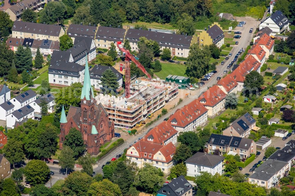 Bochum from the bird's eye view: Construction site for the new building of a apartment house next to the Petri church in Bochum in the state North Rhine-Westphalia