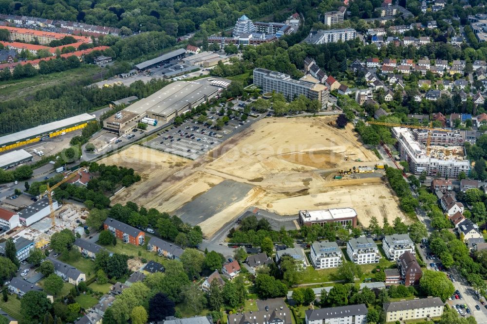 Dortmund from the bird's eye view: Construction site for the new building Mehrfamilienhaus in Dortmund in the state North Rhine-Westphalia, Germany