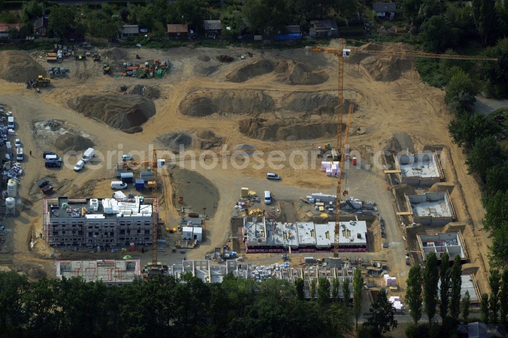 Berlin from the bird's eye view: Construction site for the new building of a residential area and settlement in the Lankwitz part of Berlin in Germany. The project is undertaken by part AG