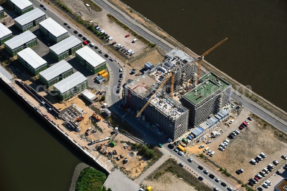 Hamburg from the bird's eye view: Construction site to build a new multi-family residential complex on Baakenallee in the district HafenCity in Hamburg, Germany