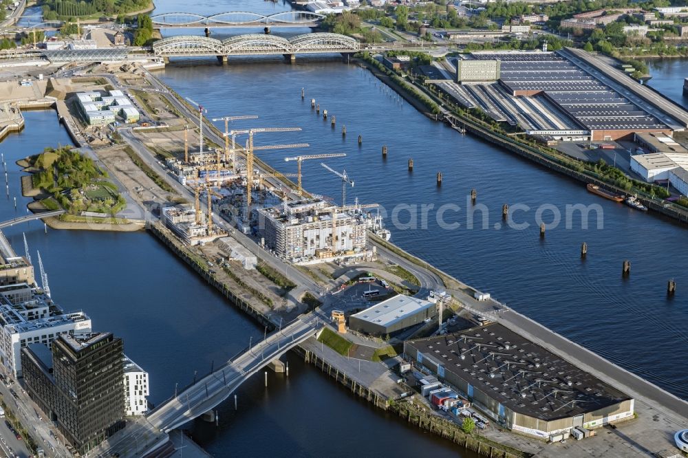 Hamburg from the bird's eye view: Construction site to build a new multi-family residential complex Baakenhafen on Baakenallee in Hamburg, Germany