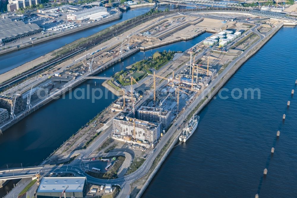 Hamburg from the bird's eye view: Construction site to build a new multi-family residential complex Baakenhafen on Baakenallee in Hamburg, Germany