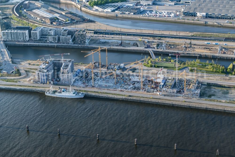 Hamburg from the bird's eye view: Construction site to build a new multi-family residential complex Baakenhafen on Baakenallee in Hamburg, Germany