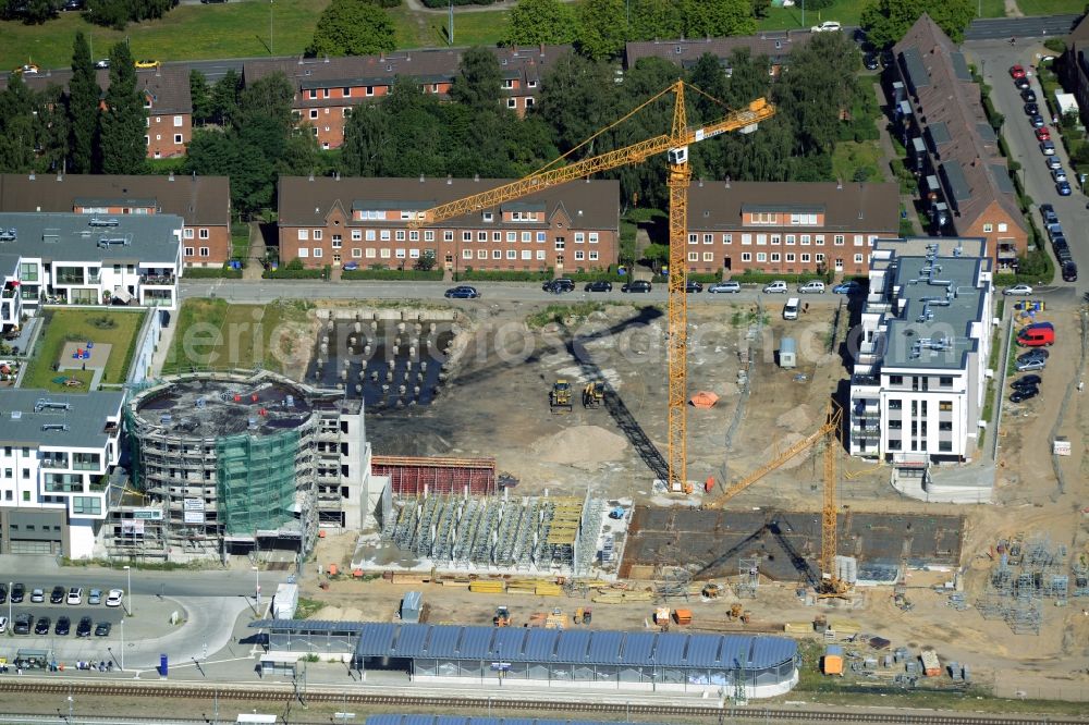 Aerial image Rostock - Construction site to build a new multi-family residential complex at the train station Warnemuende Werft in Rostock in the state Mecklenburg - Western Pomerania