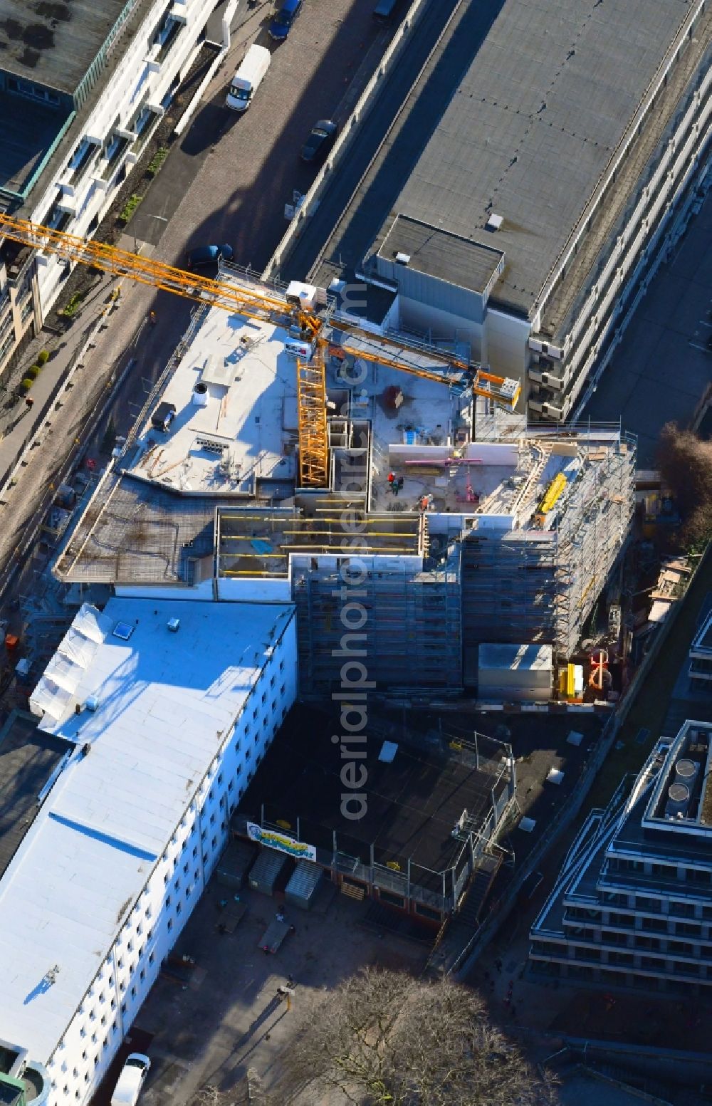 Hamburg from the bird's eye view: Construction site to build a new multi-family residential complex of Bauplan Nord GmbH & Co. KG on Warburgstrasse in Hamburg, Germany