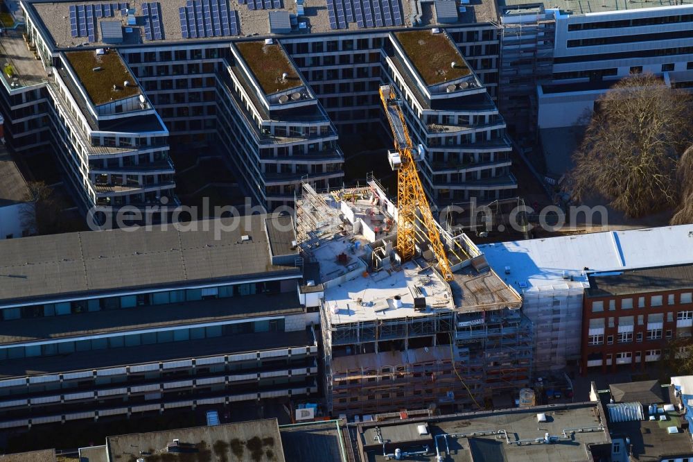 Hamburg from the bird's eye view: Construction site to build a new multi-family residential complex of Bauplan Nord GmbH & Co. KG on Warburgstrasse in Hamburg, Germany