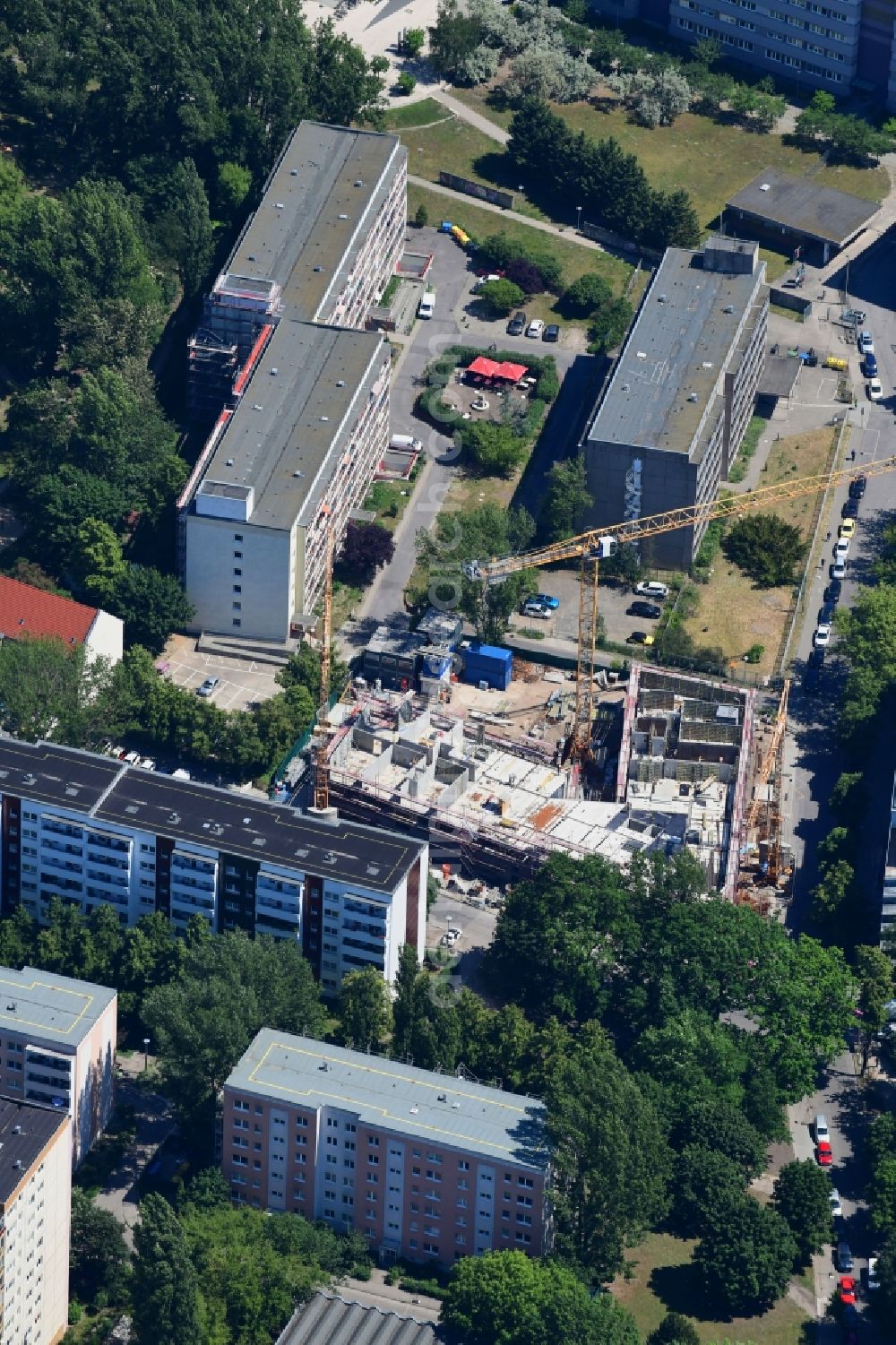 Berlin from the bird's eye view: Construction site to build a new multi-family residential complex of Belle Epoque Gesellschaft fuer behutsame Stadterneuerung mbH on Alfred-Kowalke-Strasse - Charlottenstrasse in the disrict Friedrichsfelde in Berlin, Germany