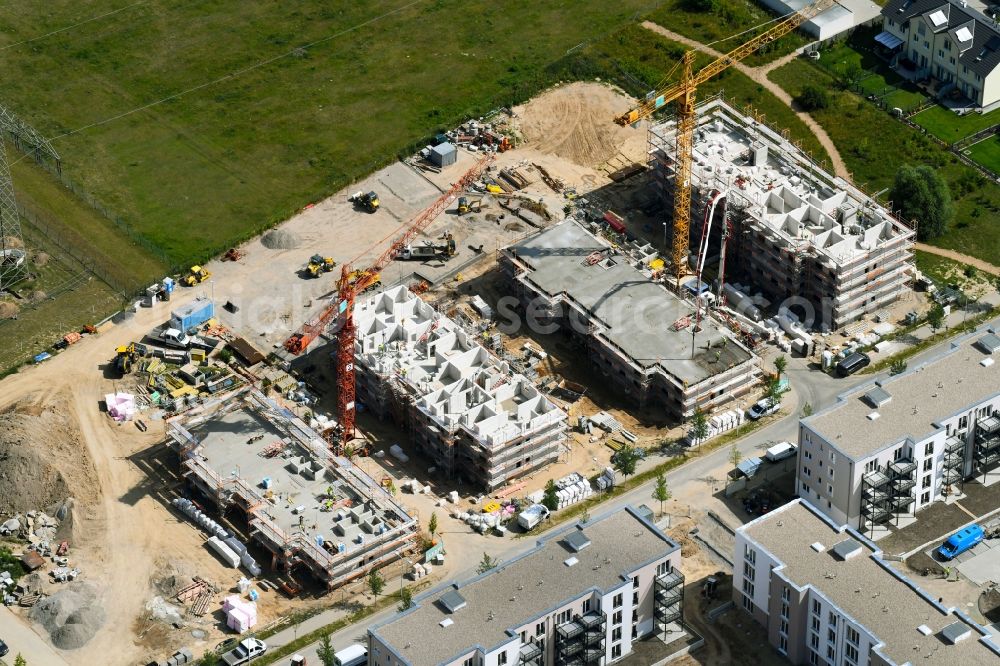 Schönefeld from the bird's eye view: Construction site to build a new multi-family residential complex of Bonava Deutschland GmbH on Bertolt-Brecht-Allee in Schoenefeld in the state Brandenburg, Germany