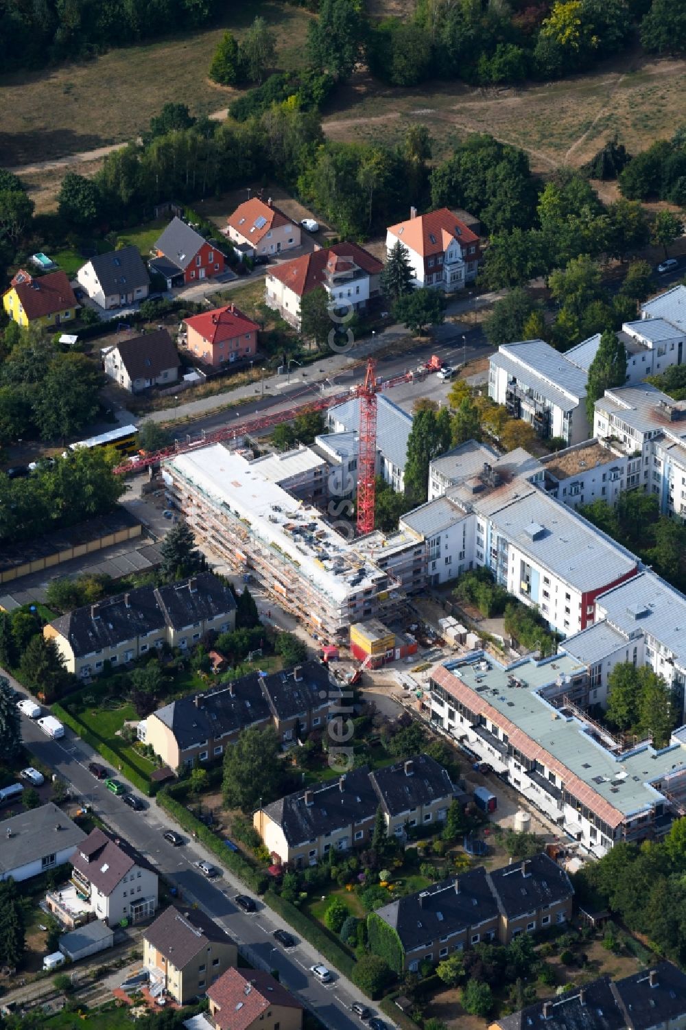 Berlin from the bird's eye view: Construction site to build a new multi-family residential complex Britzer Strasse in the district Mariendorf in Berlin, Germany